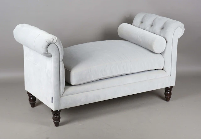 A modern daybed by Sweetpea & Willow, upholstered in buttoned grey