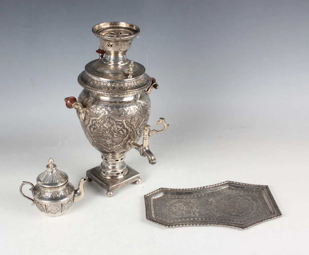 A 20th century Persian silver diminutive three-piece tea service