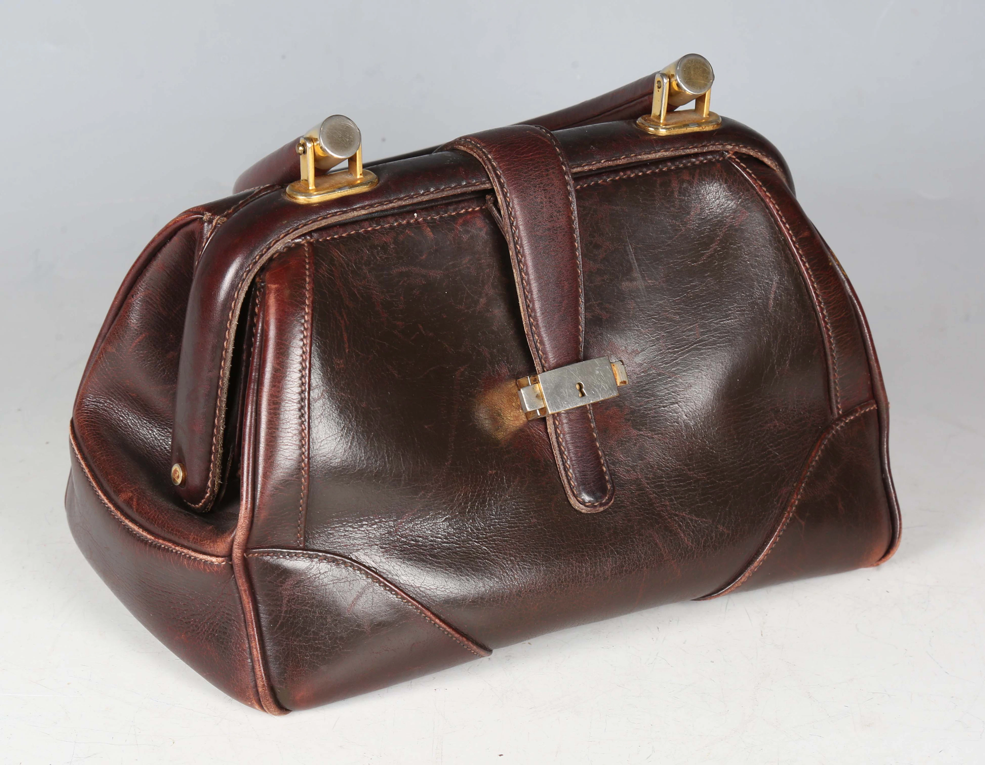 A Gucci brown leather doctor's style handbag with loop handle and