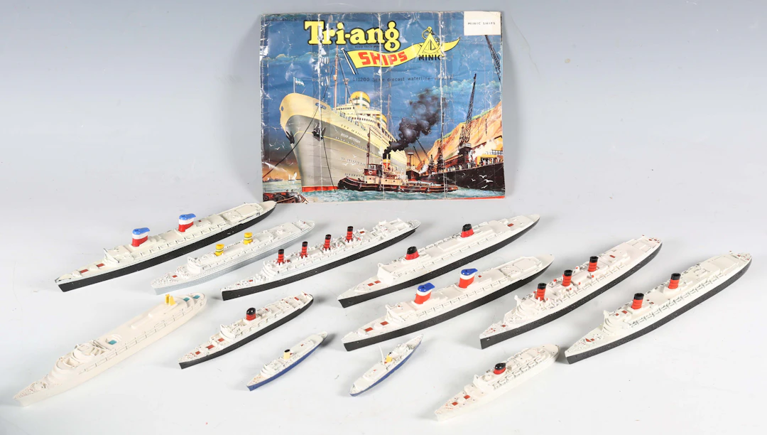 A collection of Tri-ang ships and accessories, including three M702s