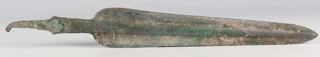 A Luristan bronze spearhead, circa 1200-600 BC, the double-edged blade