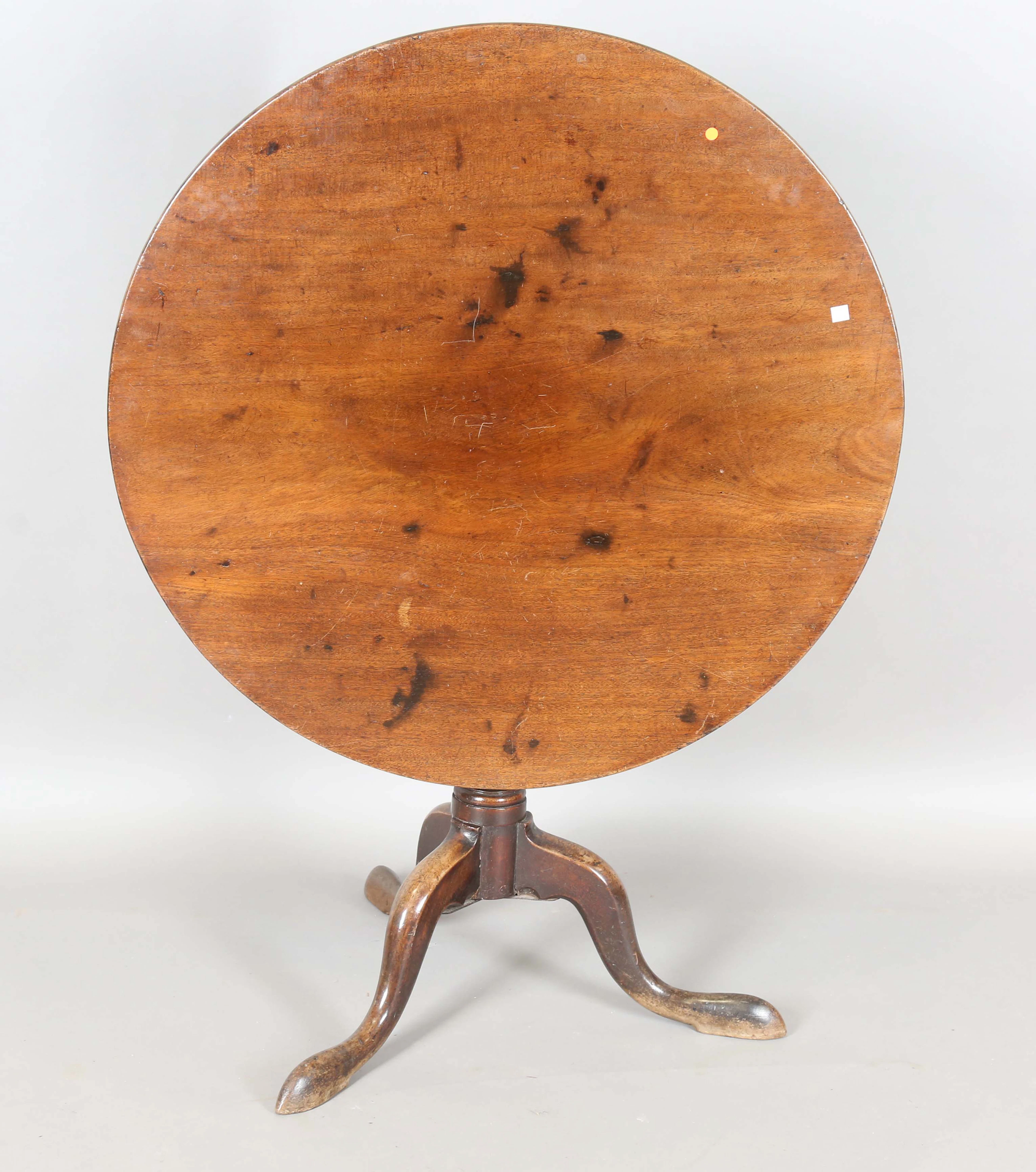 A George III mahogany circular tip-top supper table with a birdcage