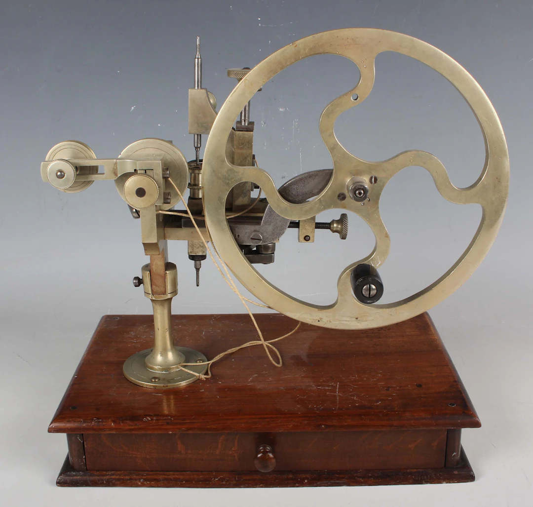A late 19th century nickel and steel watchmaker's topping tool, variously