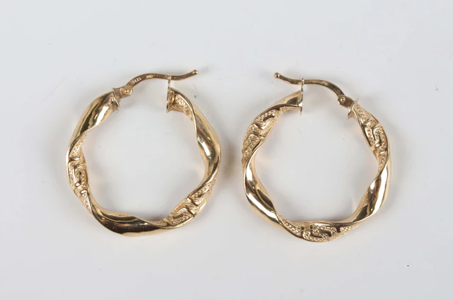 A pair of Italian gold hoop shaped earrings of twist design, detailed