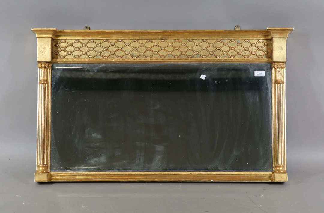 A 19th century giltwood and gesso overmantel mirror, the lattice moulded