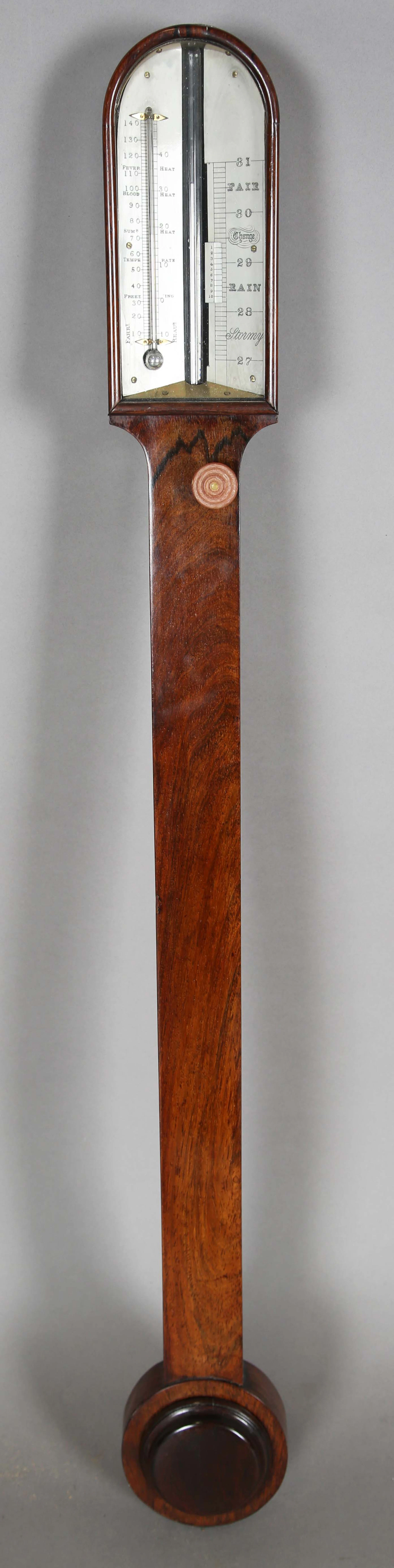 A Victorian rosewood cased stick barometer, the arched ivorine dial