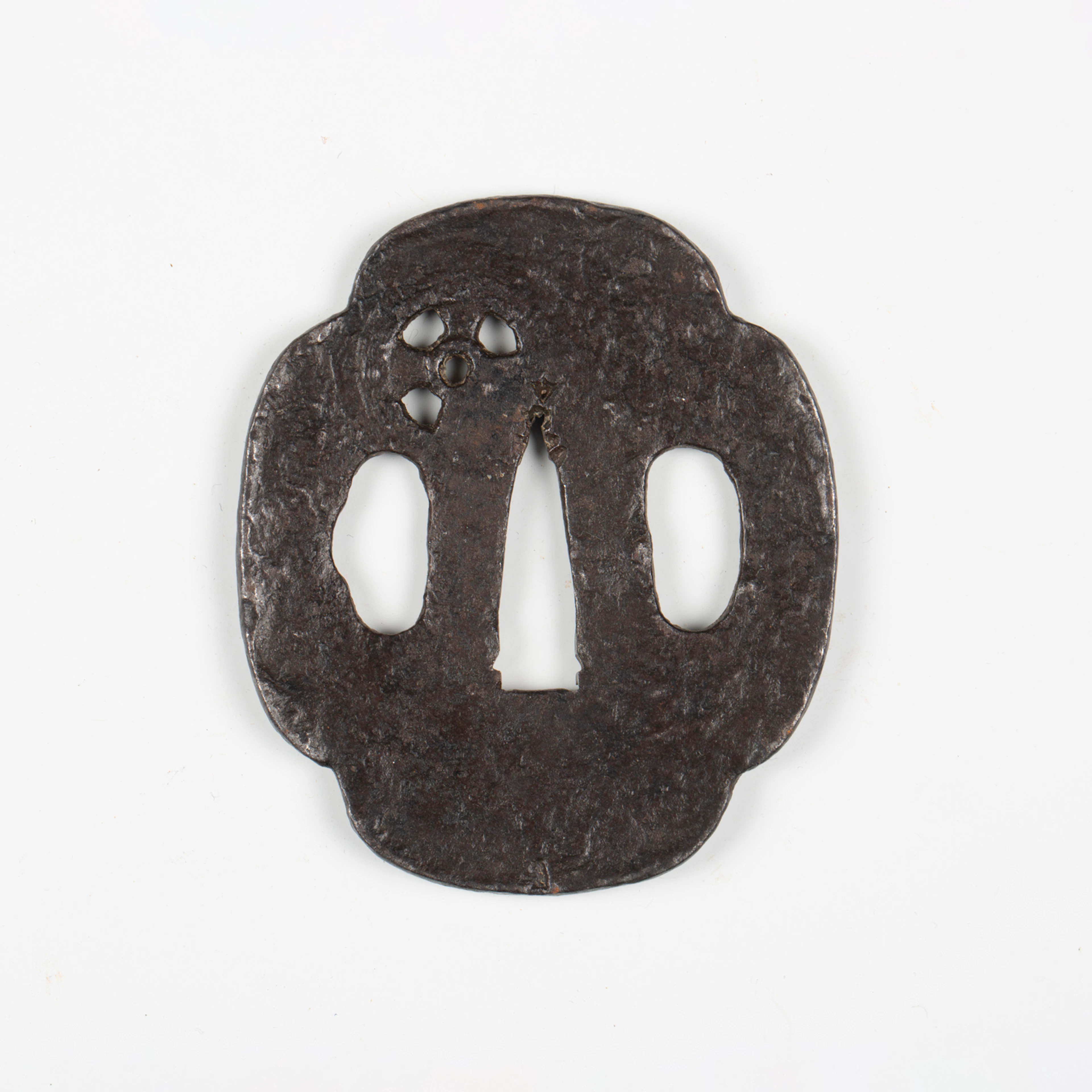 A Japanese shaped oval iron sukashi tsuba, probably late Muromachi