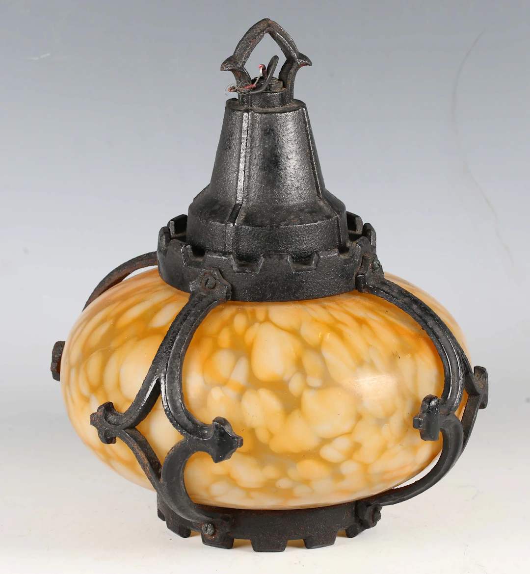 An early 20th century Arts and Crafts mottled glass and cast metal