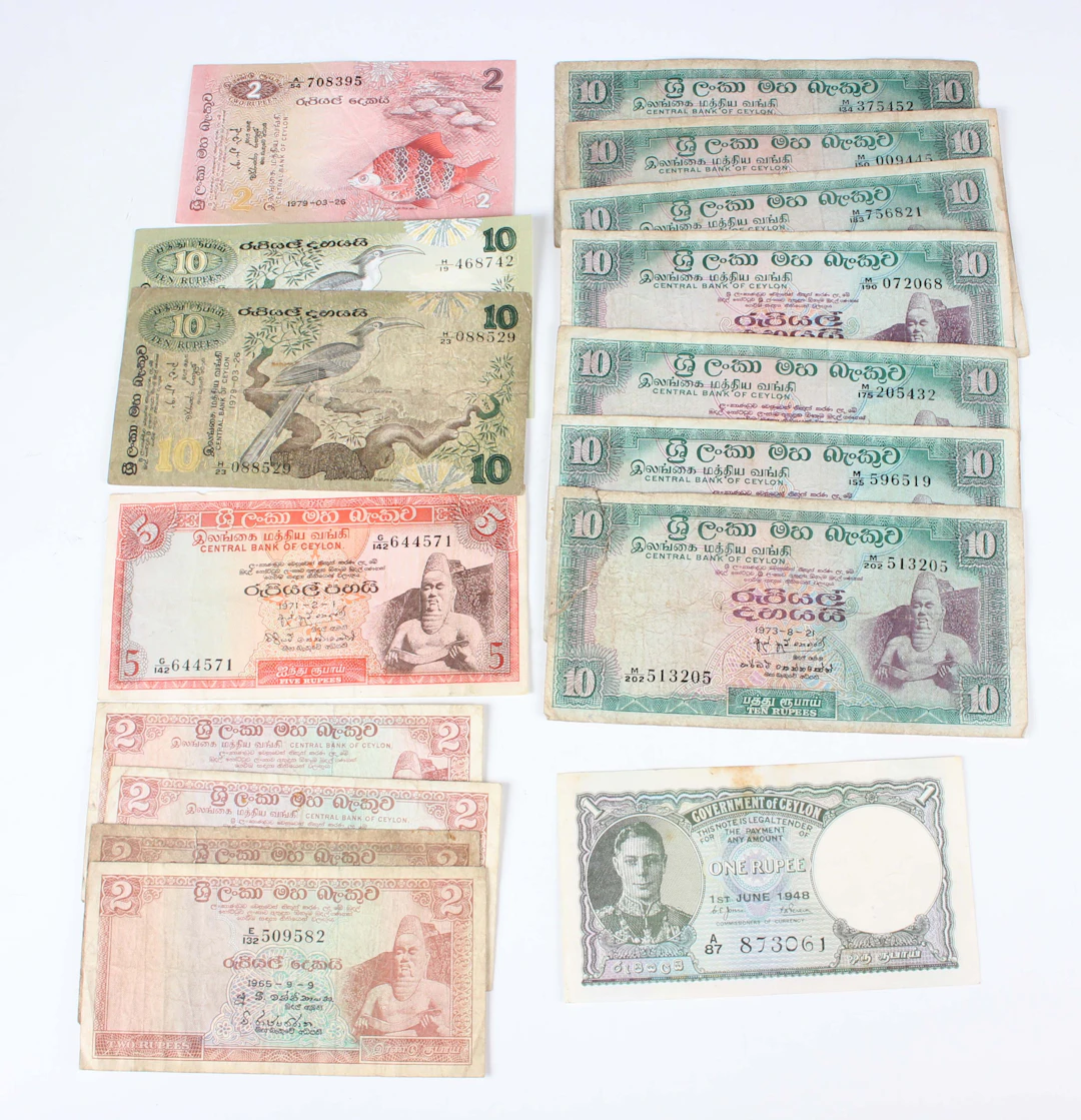 A large collection of mixed European and world banknotes, including
