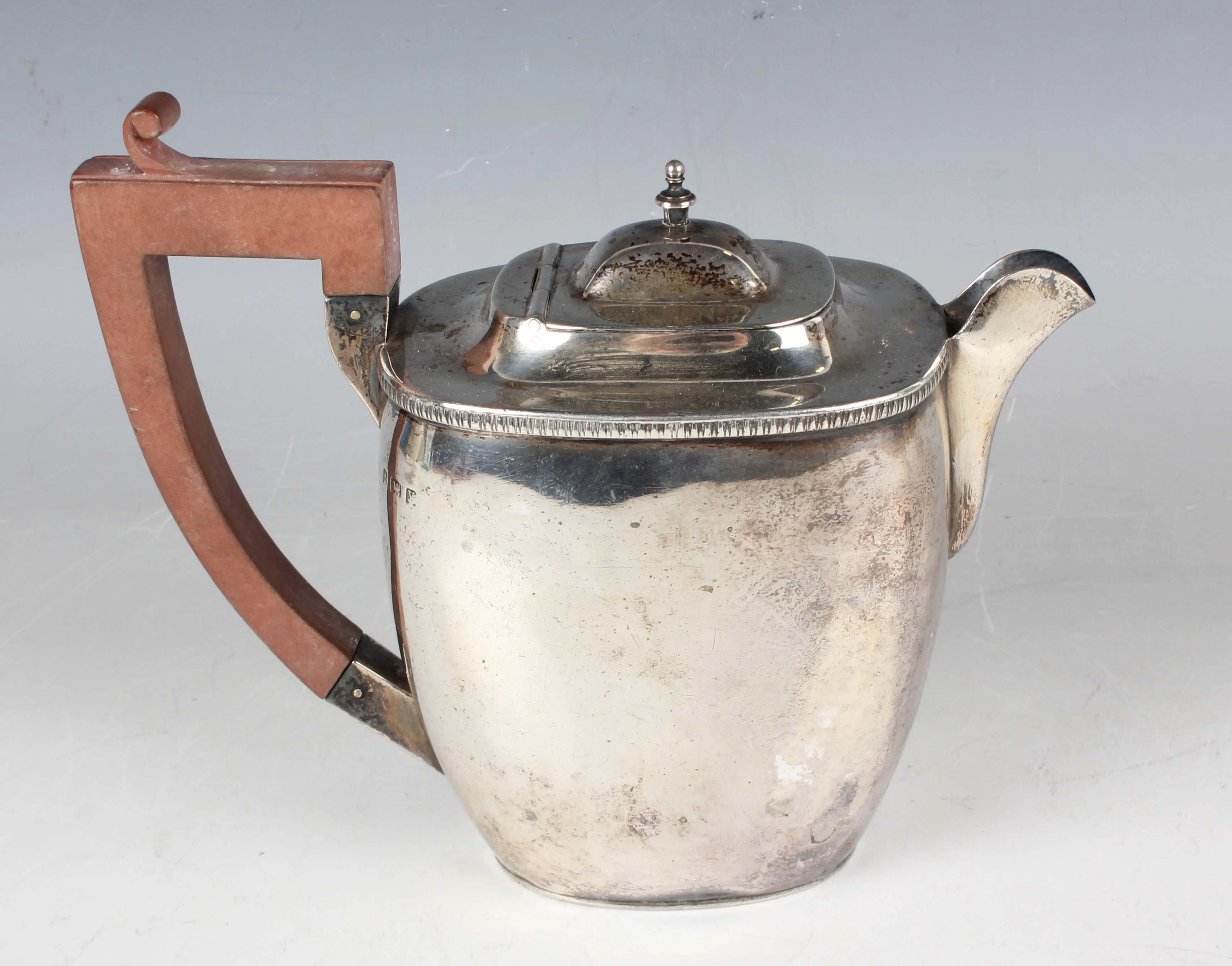 A George V silver hot water pot of tapered rectangular form, Birmingham