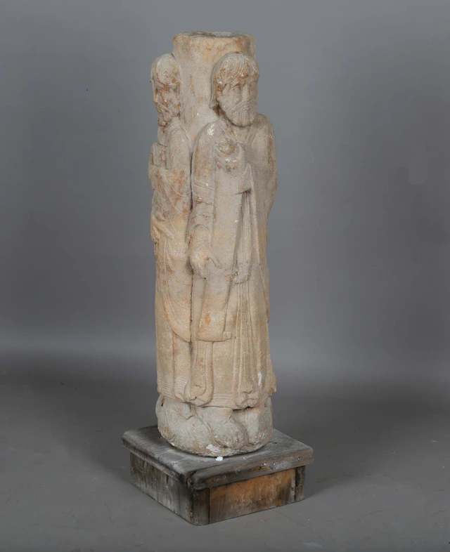 A Romanesque style composition stone architectural column, the circular
