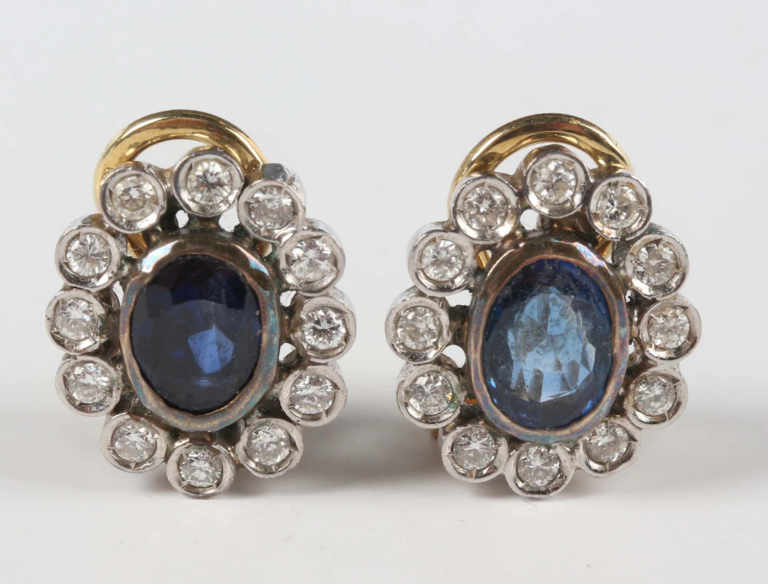 A pair of gold, sapphire and diamond oval cluster earrings, each collet