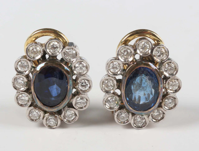 A pair of gold, sapphire and diamond oval cluster earrings, each collet