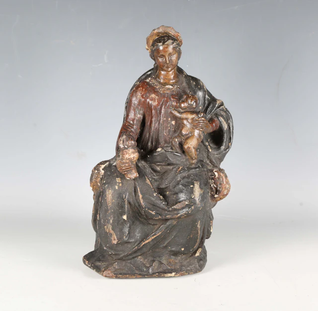 A Continental polychrome painted earthenware figure of the Madonna