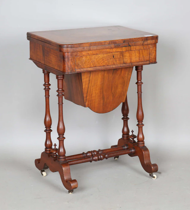 A Victorian burr walnut fold-over games/work table, the interior inlaid