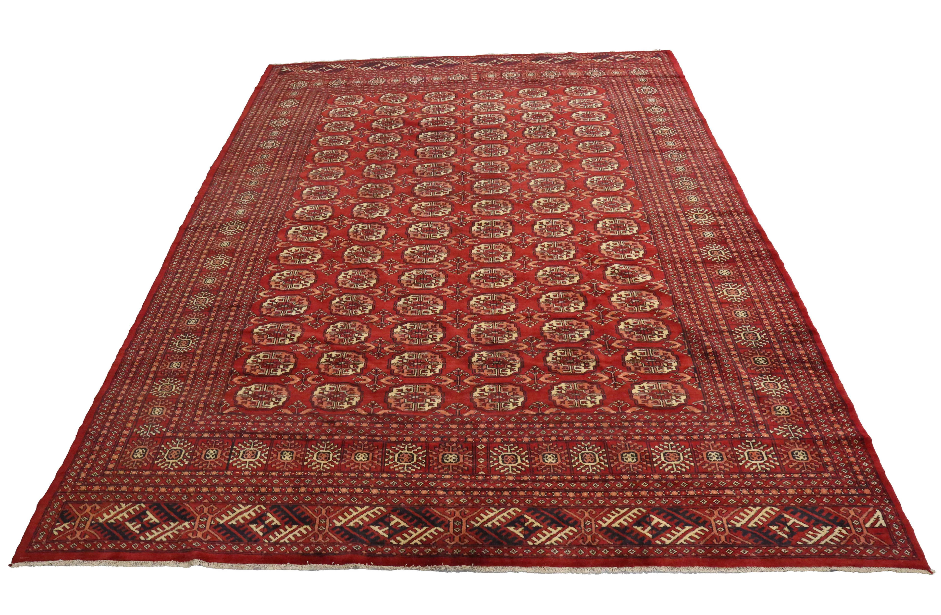 A large Turkestan carpet, mid-20th century, the red field with overall