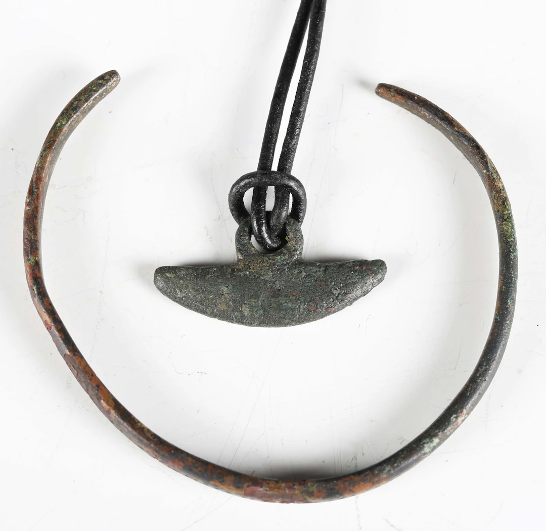 An ancient Roman or Celtic woad grinder of crescent form, 1st century