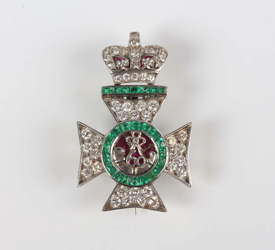 A platinum, emerald, ruby and diamond King's Royal Rifles sweetheart