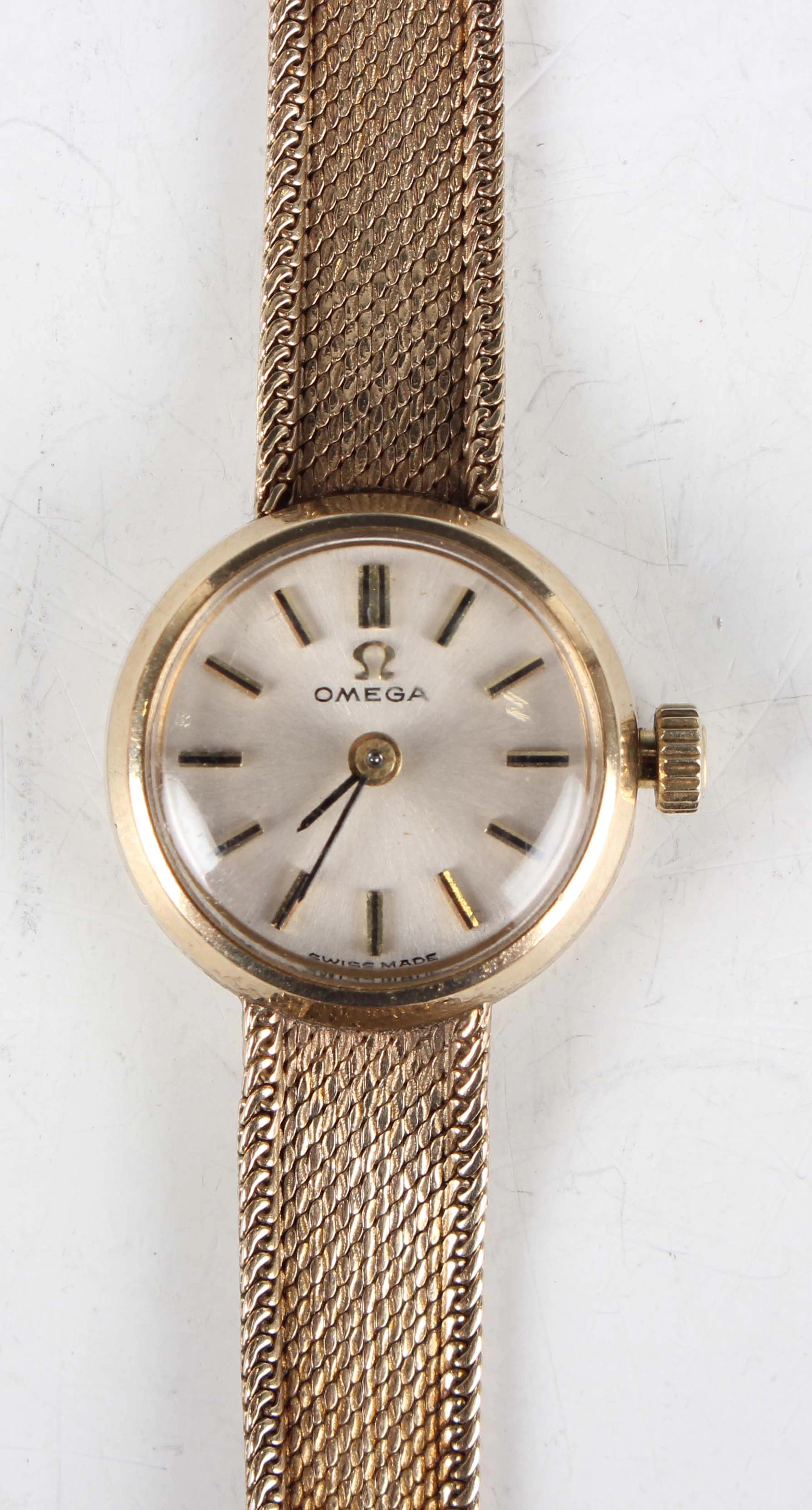 An Omega 9ct gold circular cased lady's bracelet wristwatch with signed