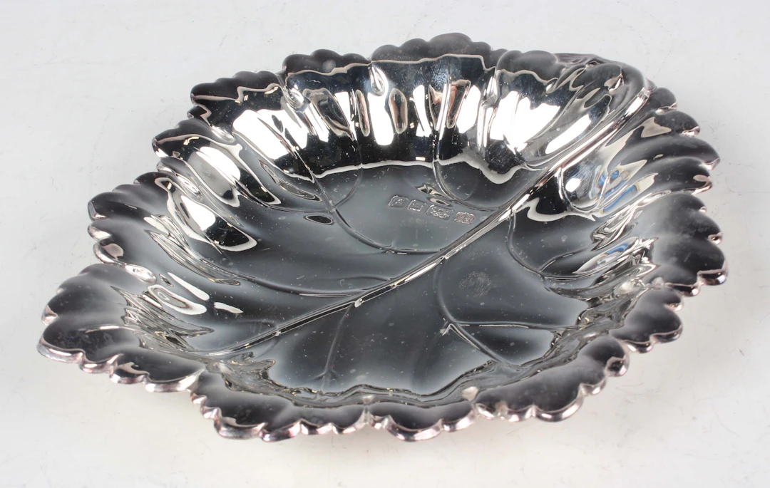 An Elizabeth II silver leaf shaped dish, Birmingham 1998 by Barker