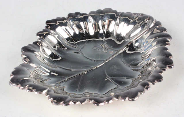An Elizabeth II silver leaf shaped dish, Birmingham 1998 by Barker