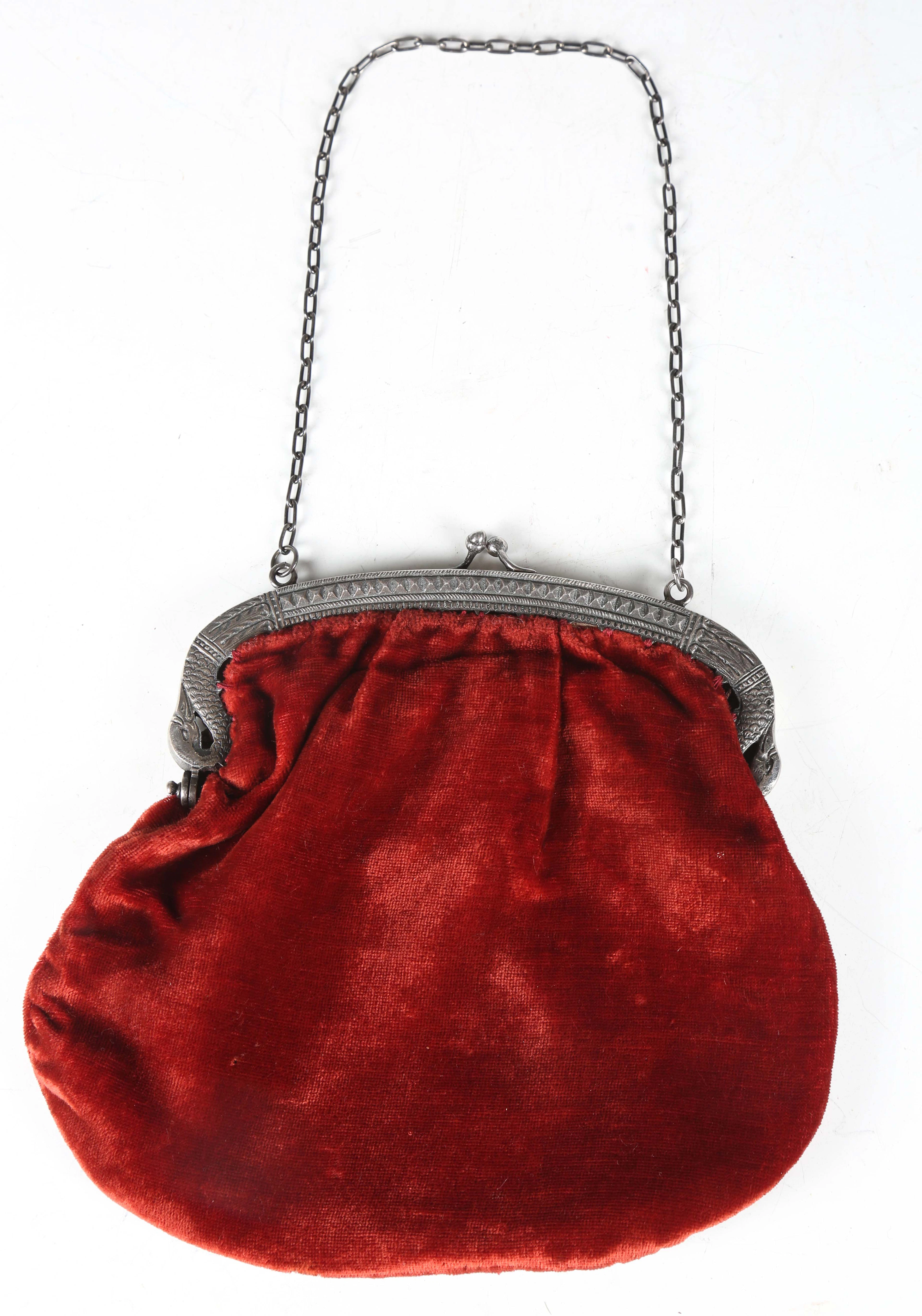 An early 20th century silver handbag clasp, chased with hobnail borders