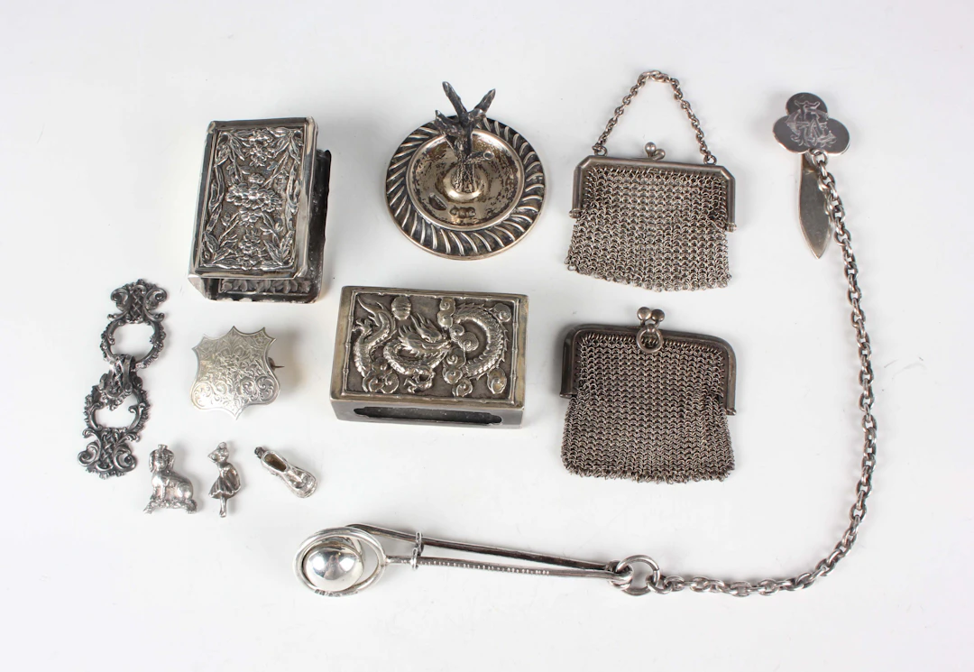 A mid-Victorian silver skirt lifter with ring and ball terminal, fitted
