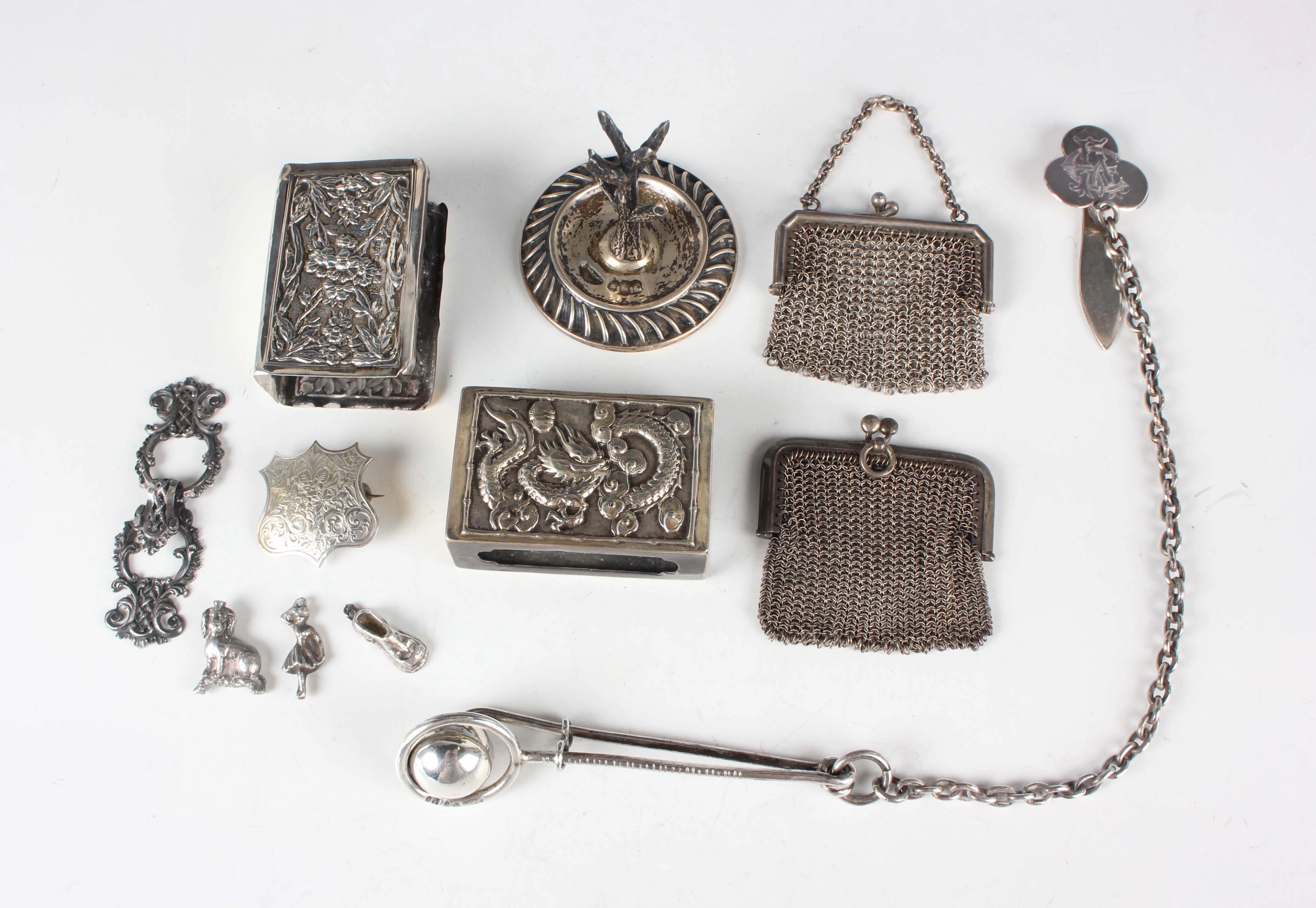 A mid-Victorian silver skirt lifter with ring and ball terminal, fitted