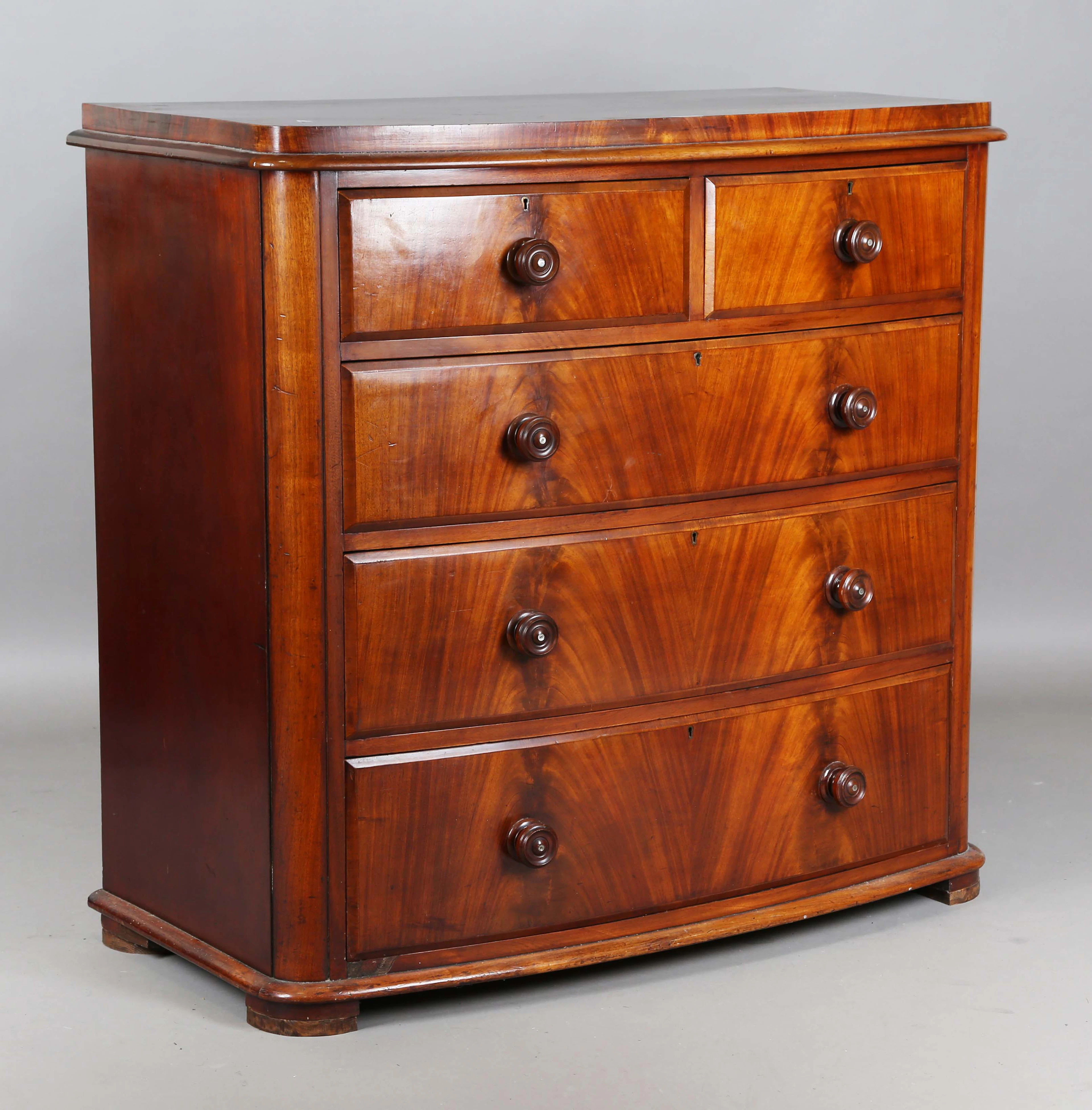A Victorian mahogany bowfront chest of two short and three long drawers