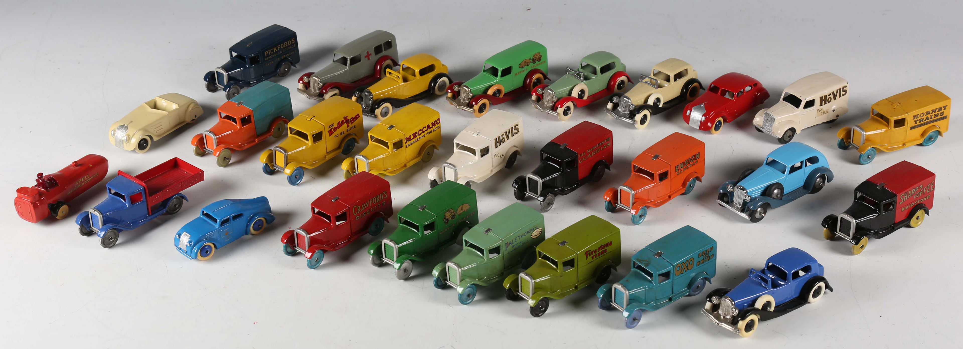 A group of Dinky Toys style vehicles, including vans, cars, truck