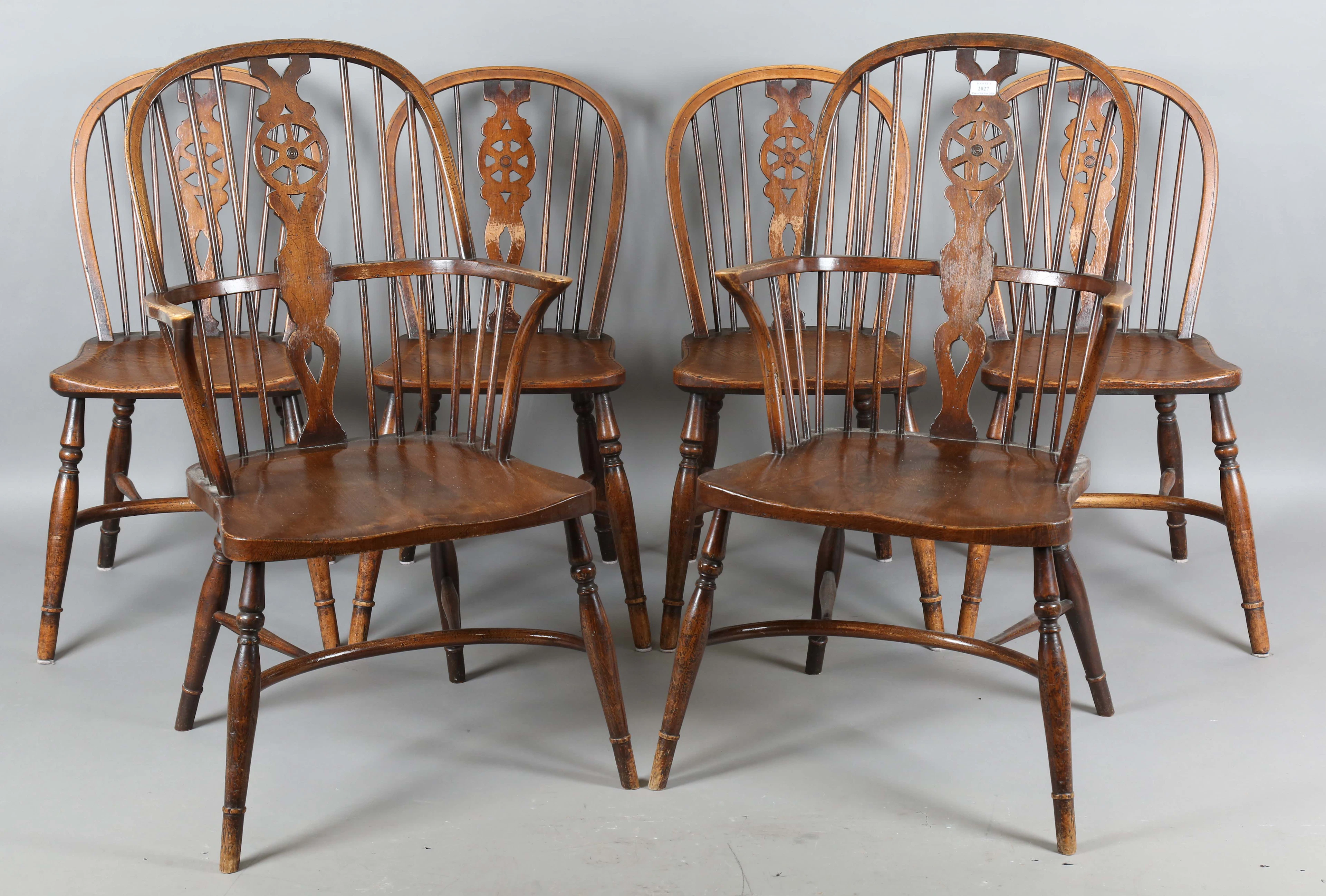 A set of six 20th century beech and elm framed Windsor chairs, comprising