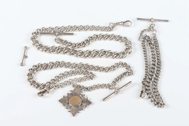 A silver graduated curblink Albert watch chain, fitted with a silver