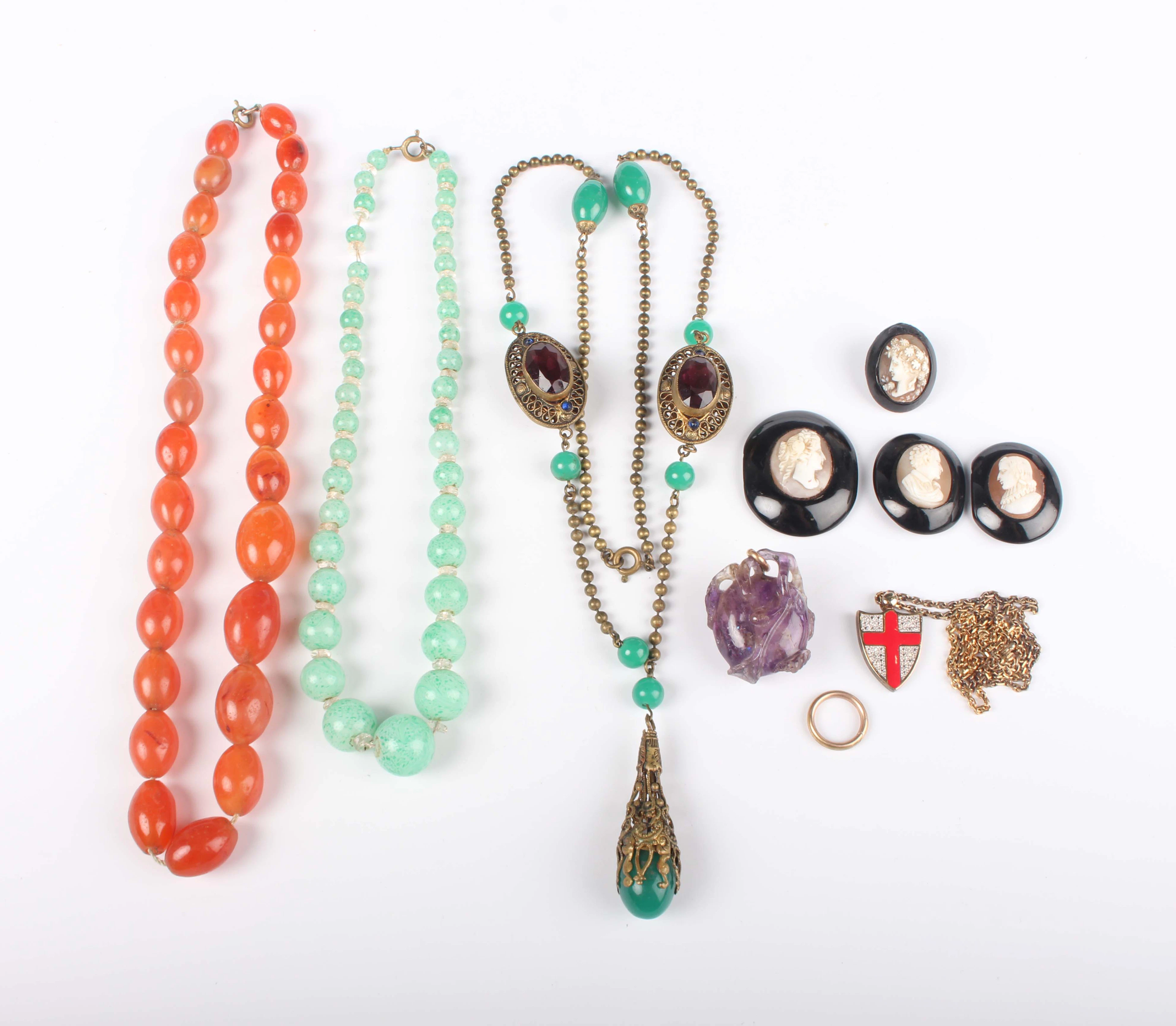 A small group of jewellery, including a carved amethyst quartz pendant