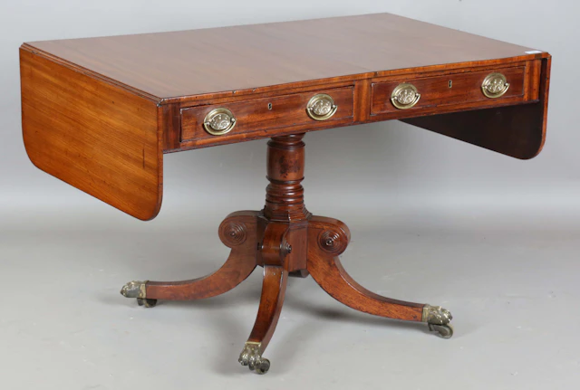 A Regency mahogany single pedestal sofa table, the drop-flap top above