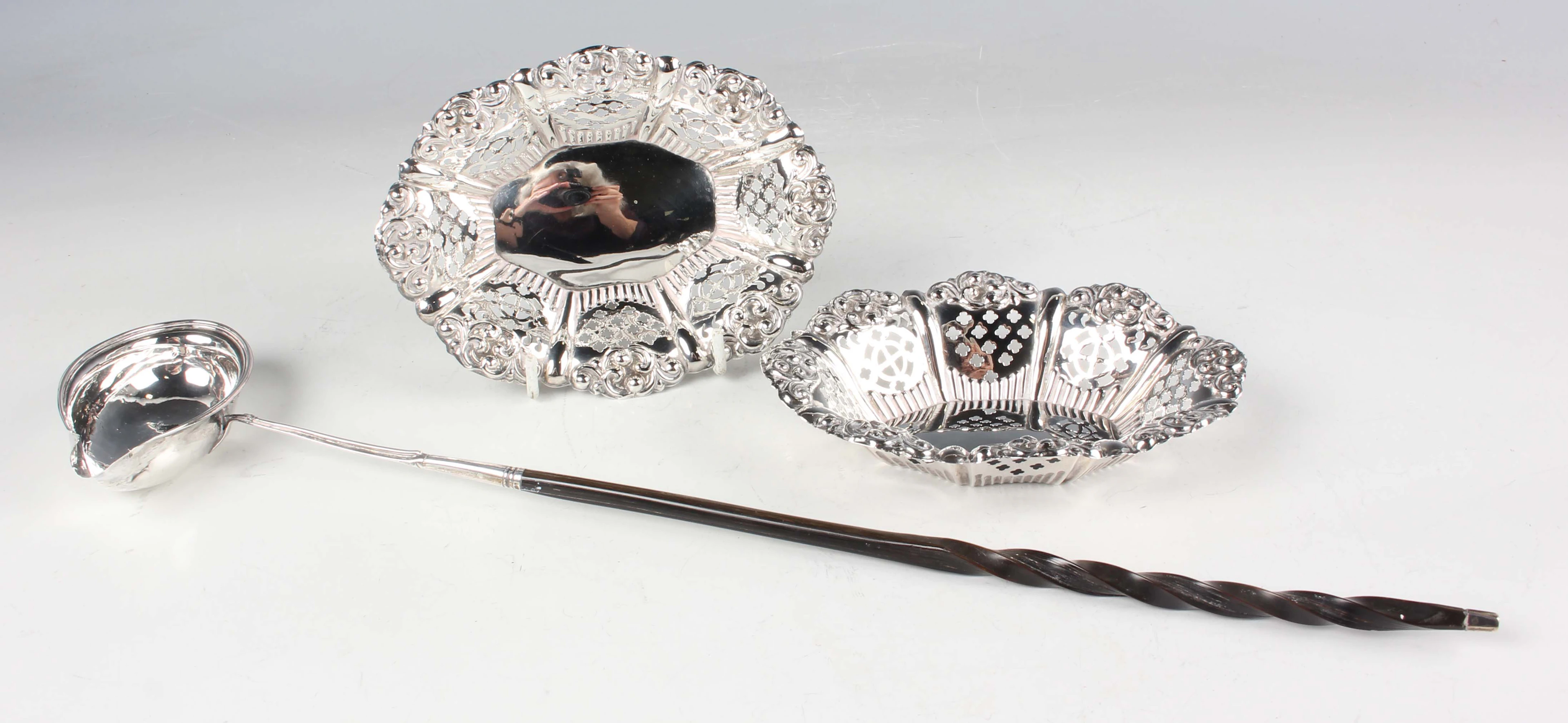 A pair of Edwardian silver oval bonbon dishes, the lobed sides pierced
