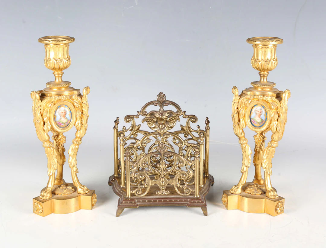A pair of 19th century French cast ormolu candlesticks, each body