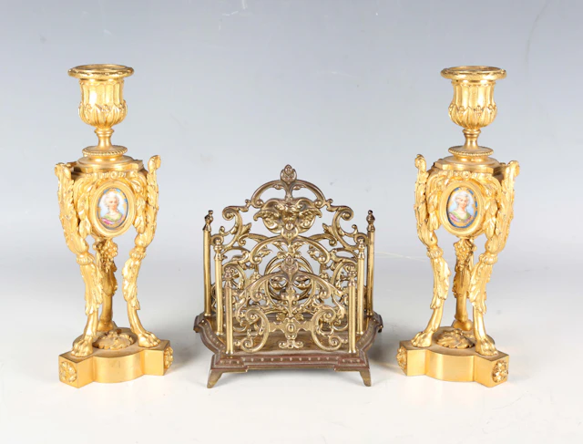 A pair of 19th century French cast ormolu candlesticks, each body
