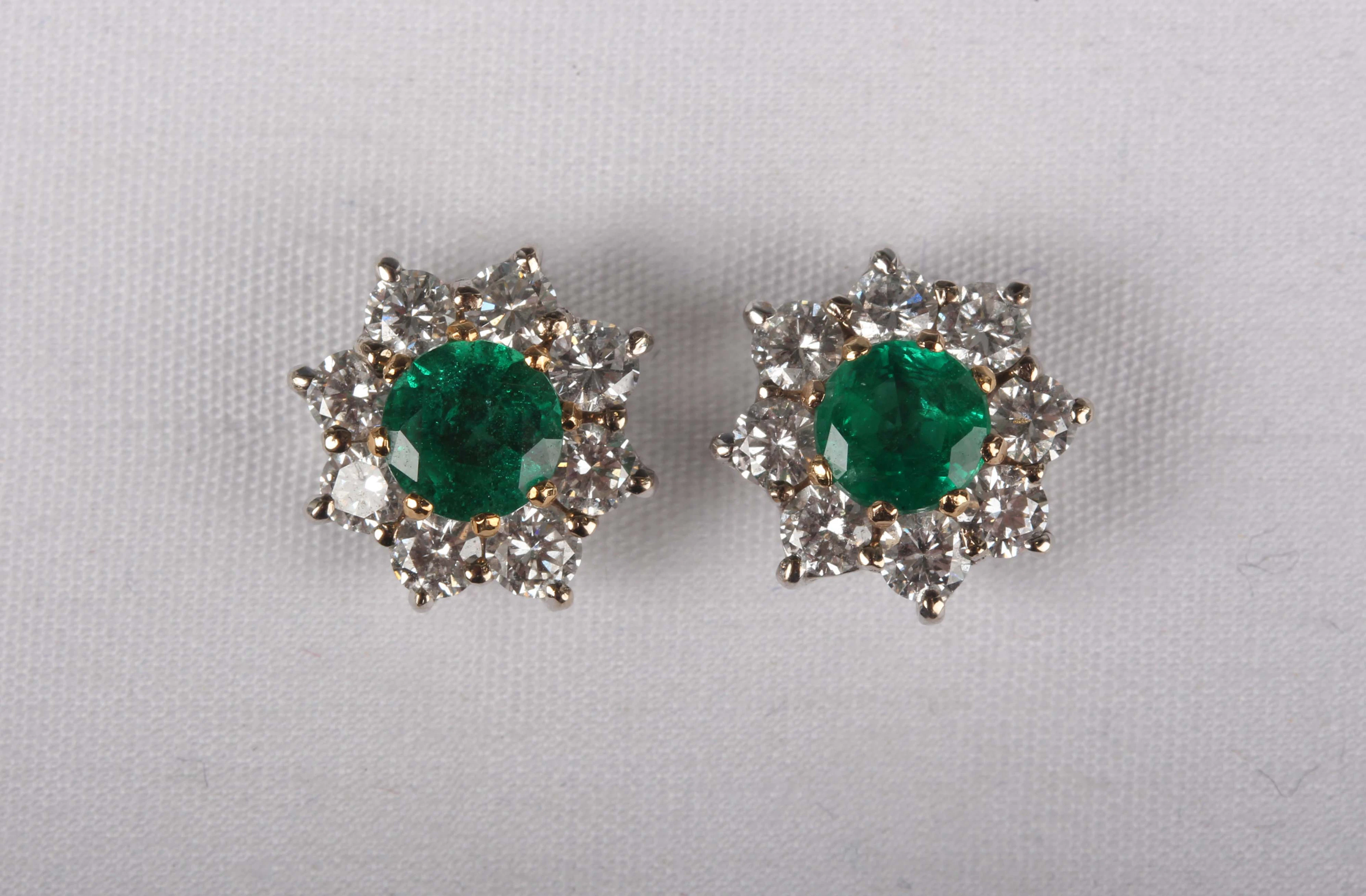 A pair of 18ct white gold, emerald and diamond cluster earstuds, each