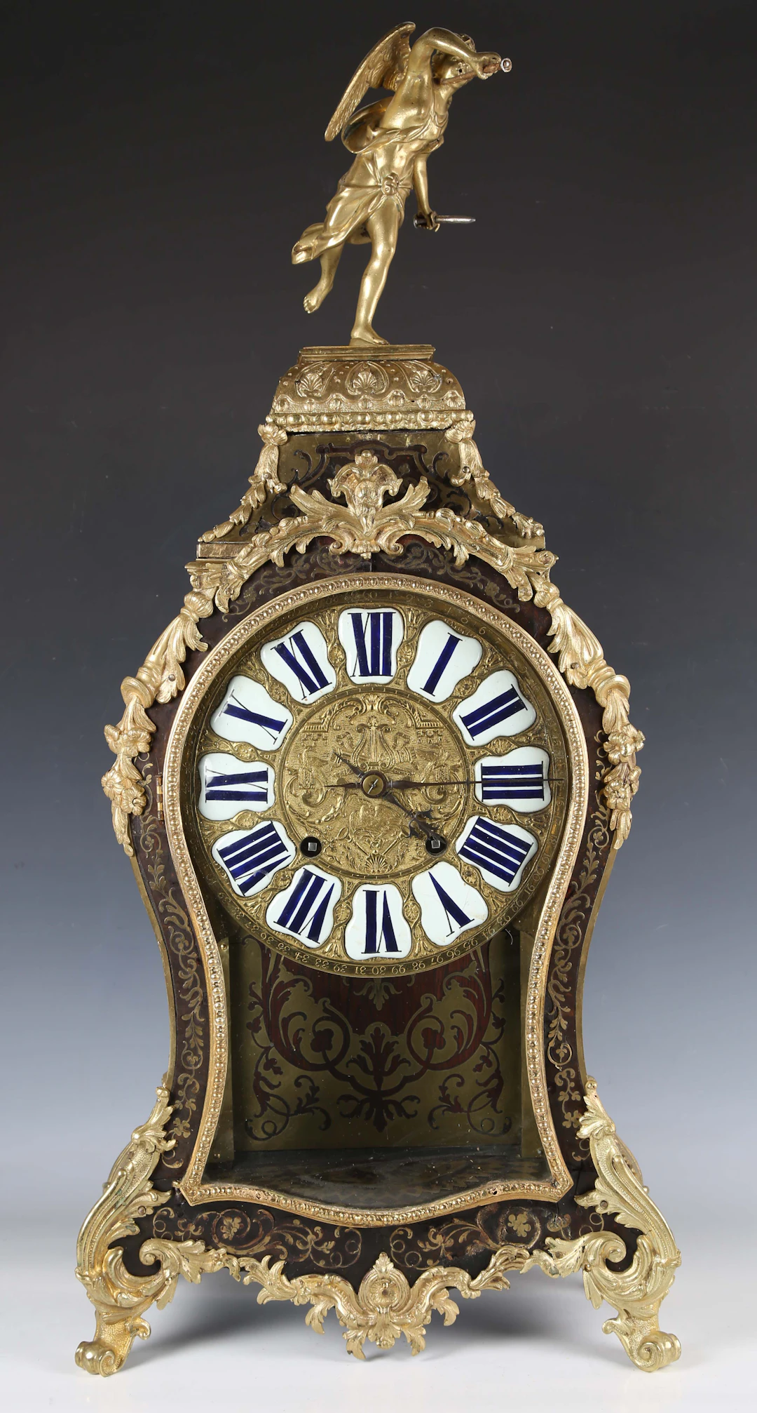 A Louis XV brown tortoiseshell and gilt brass boulle cased bracket