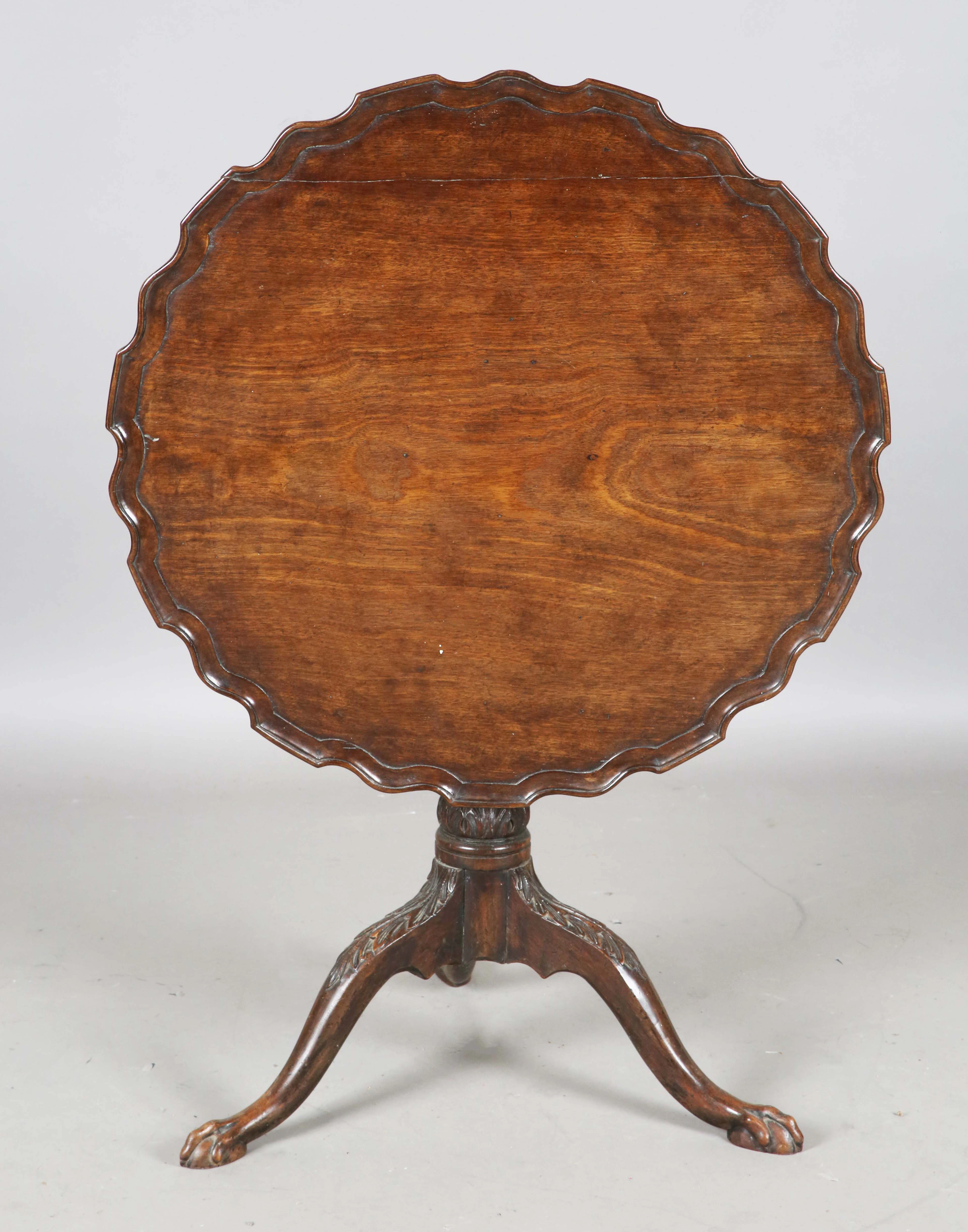 A George III mahogany tip-top circular supper table, the top with