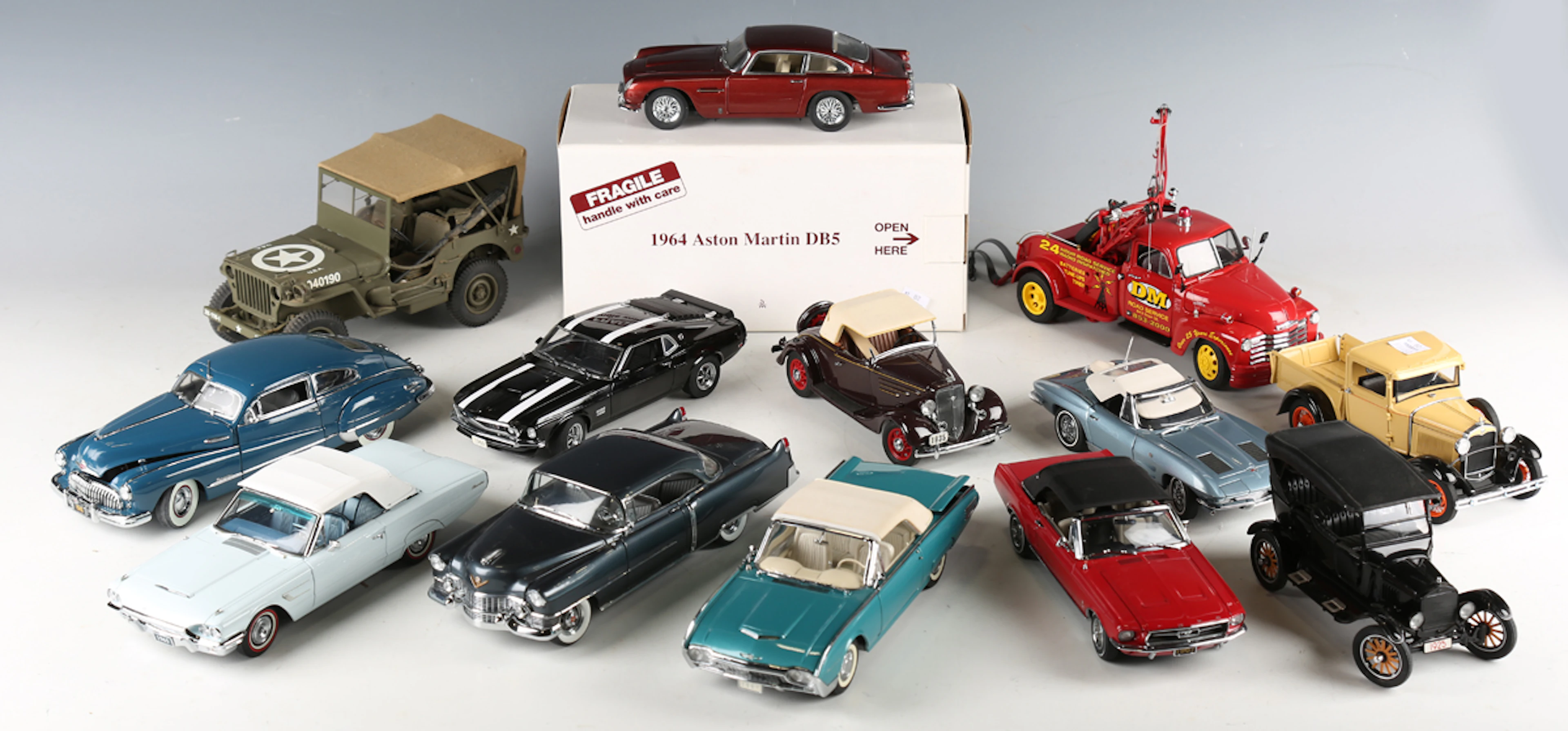Thirteen Danbury Mint 1:24 scale diecast metal model cars, comprising