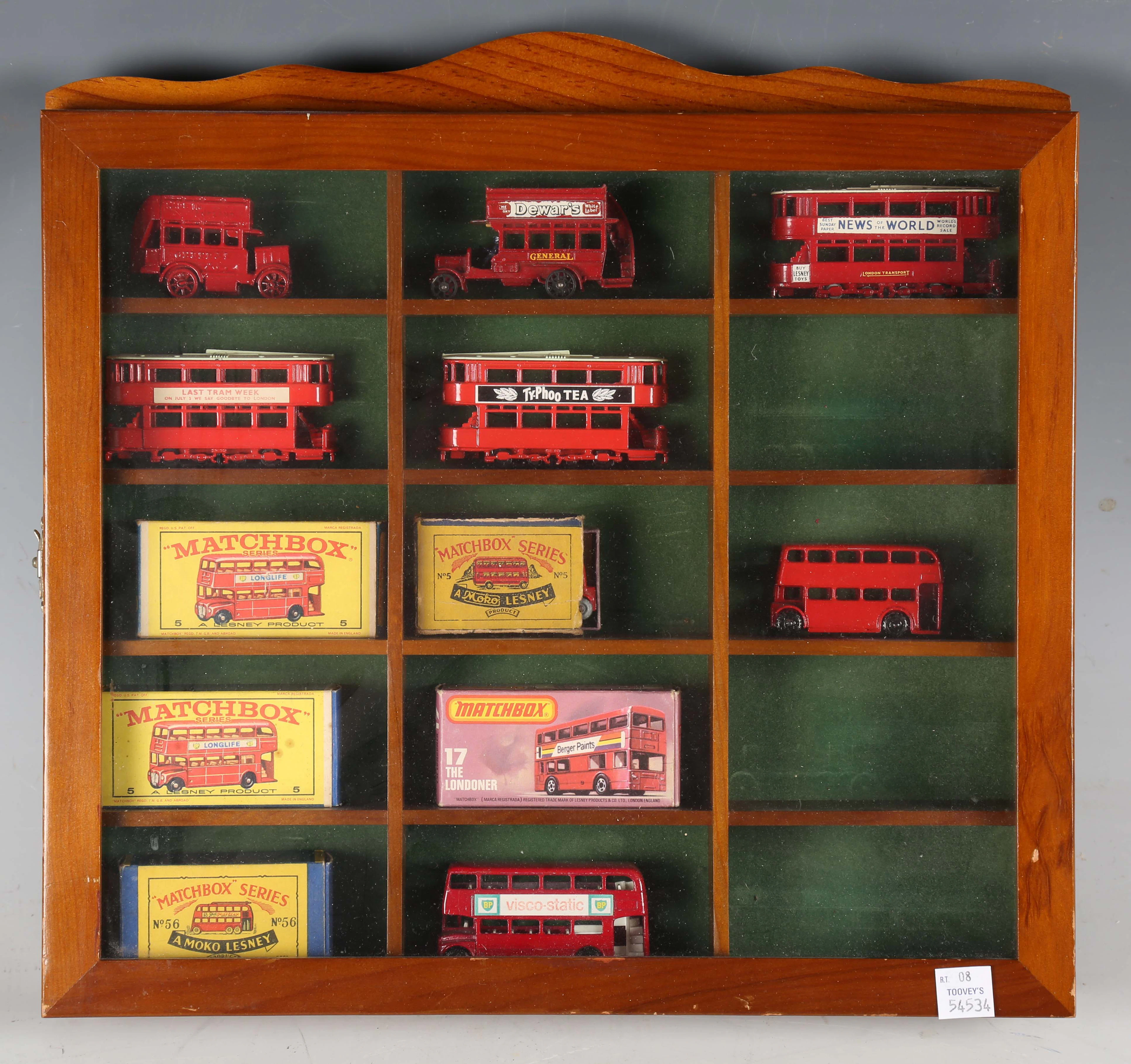 A collection of diecast model buses, including Dinky Toys No. 295