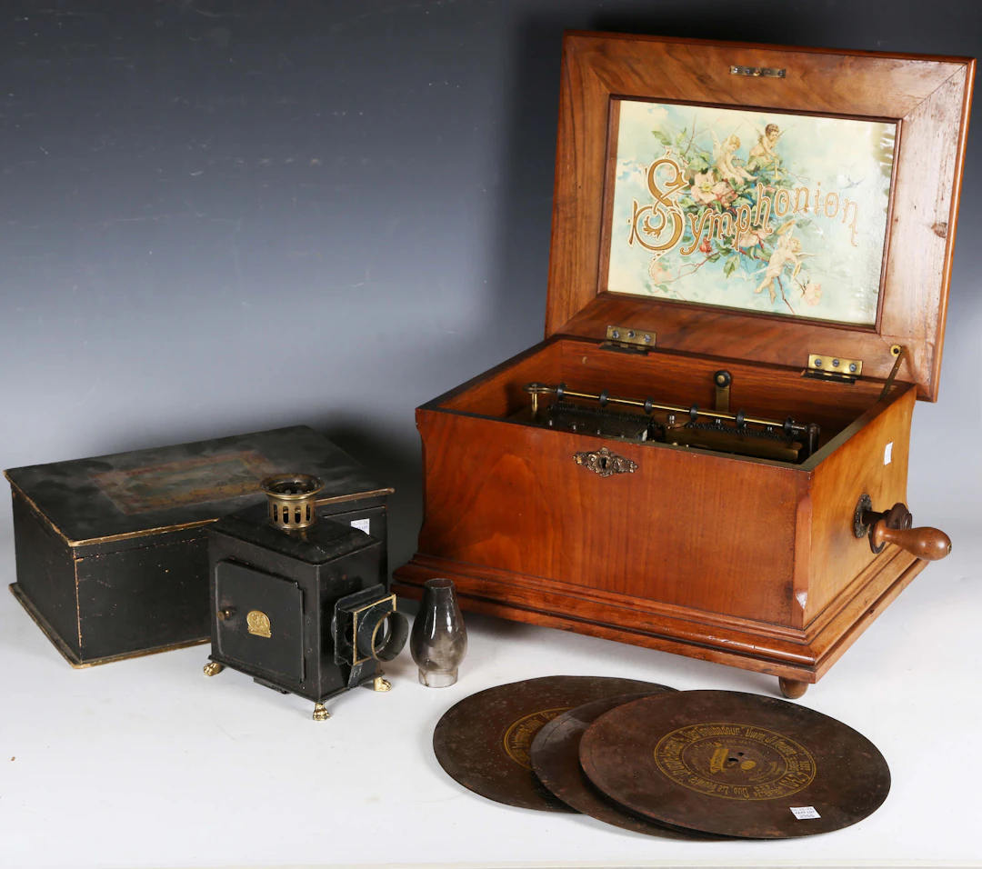 A late 19th century walnut cased Symphonion polyphon, the twin comb