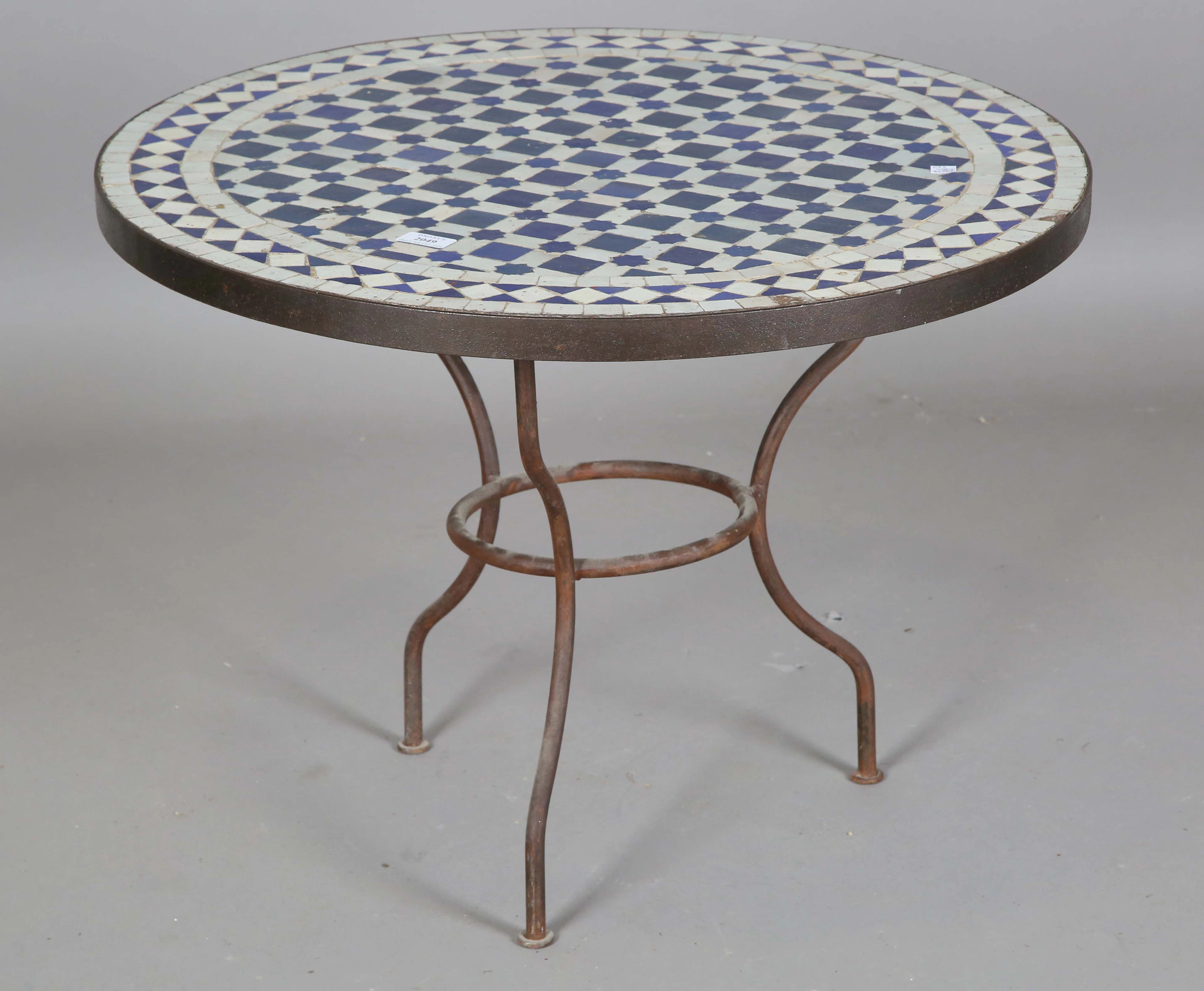 A 20th century wrought iron framed circular occasional table with