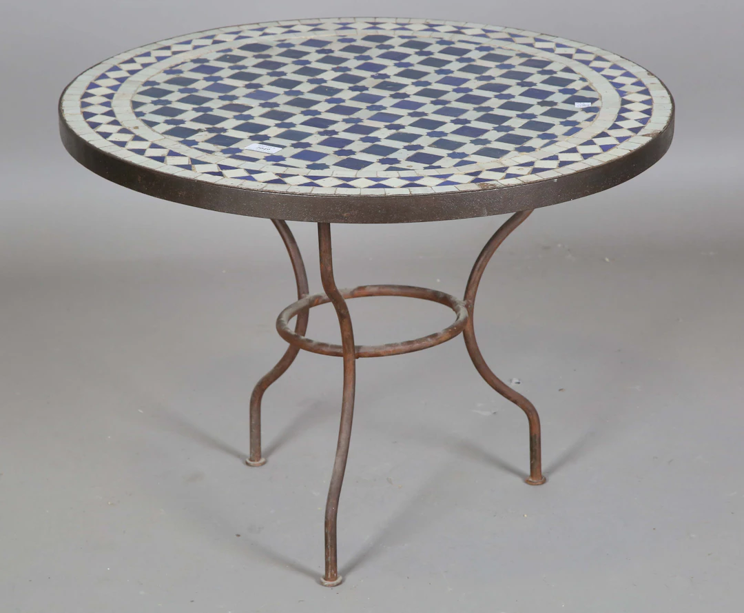 A 20th century wrought iron framed circular occasional table with