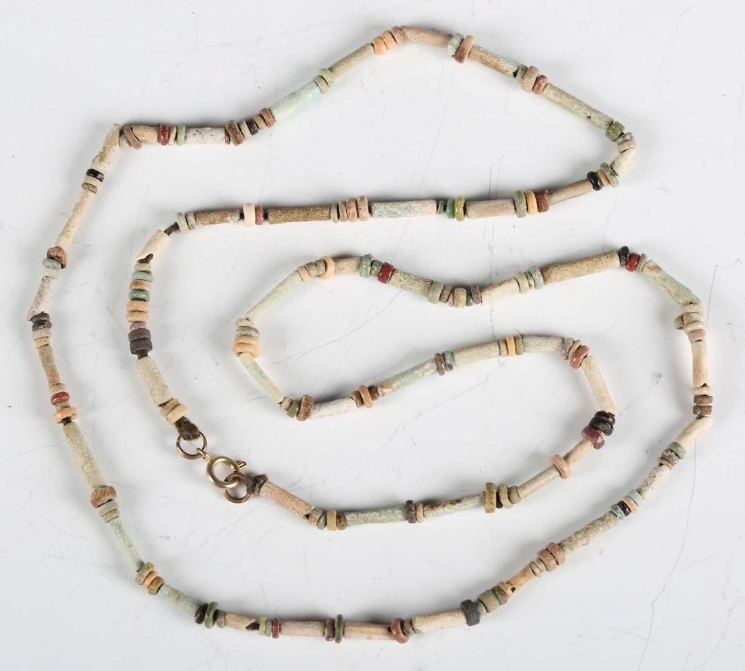 A necklace of ancient Egyptian faience beads of tube and disc form