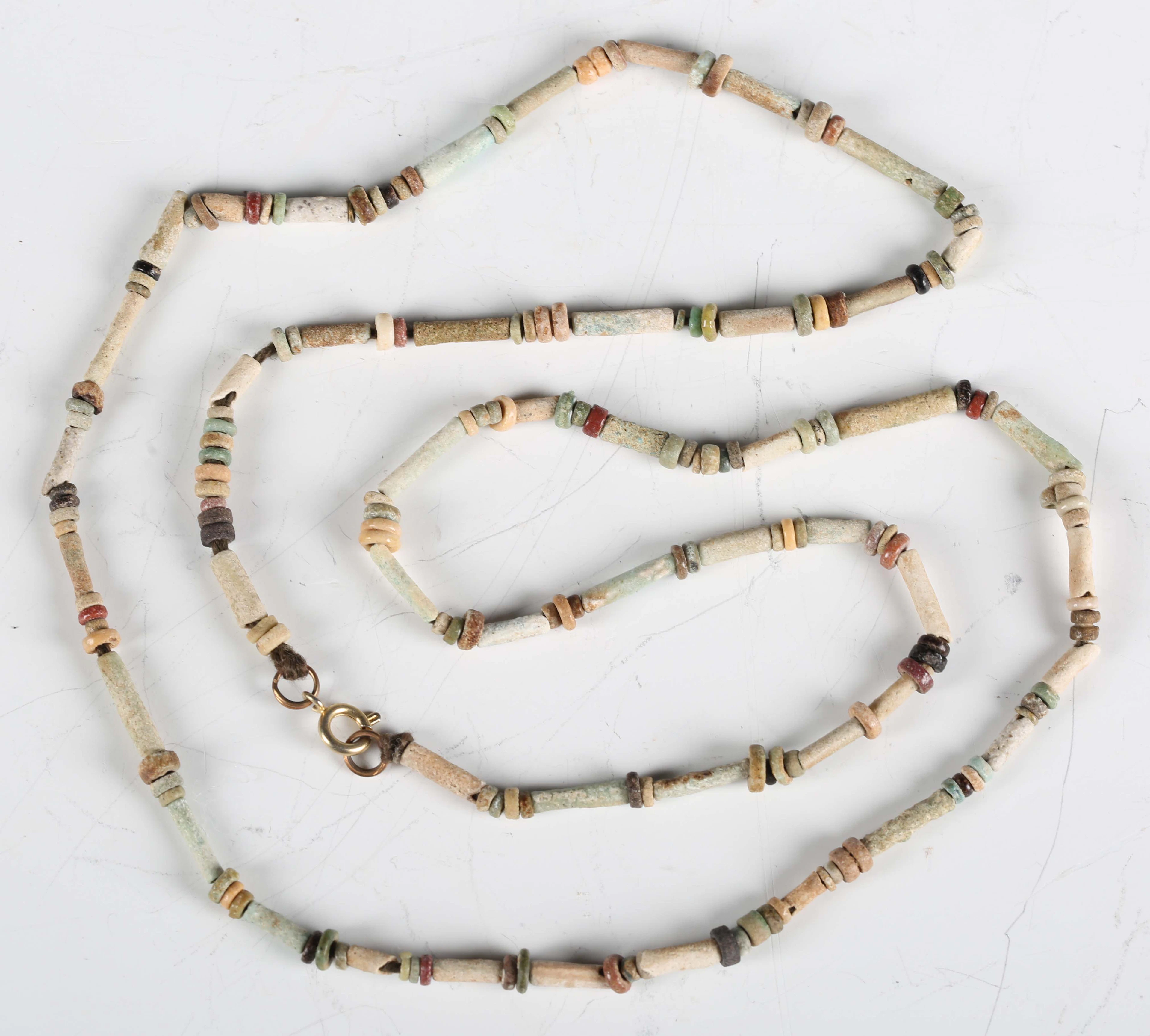 A necklace of ancient Egyptian faience beads of tube and disc form