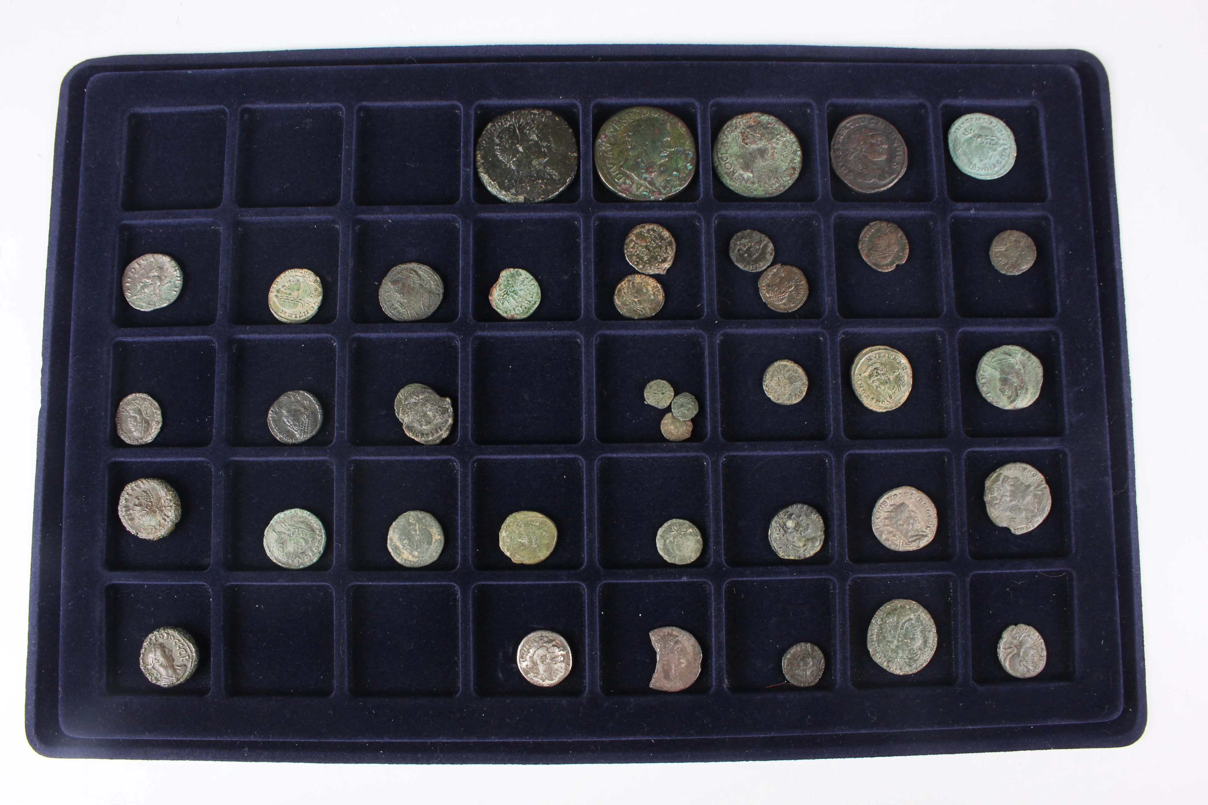 A collection of Roman bronze and copper alloy coinage, including a