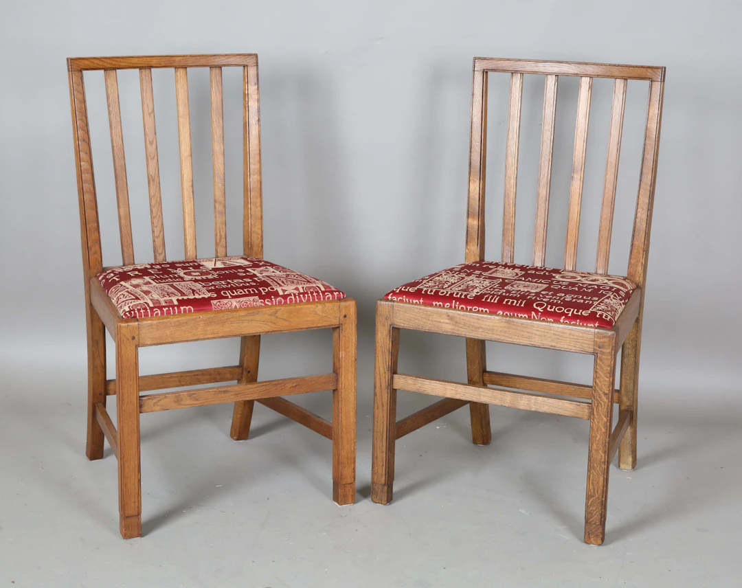 A pair of early/mid-20th century Arts and Crafts style oak framed