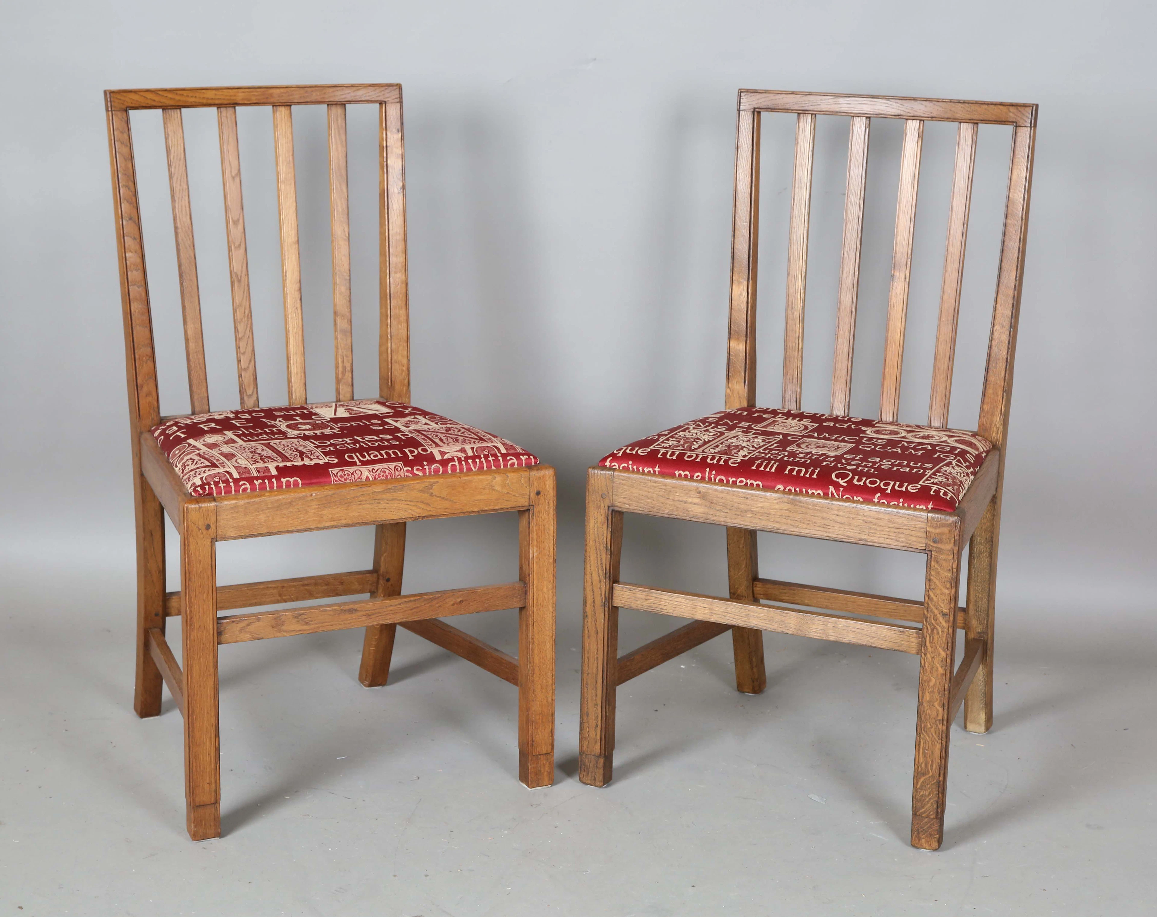 A pair of early/mid-20th century Arts and Crafts style oak framed